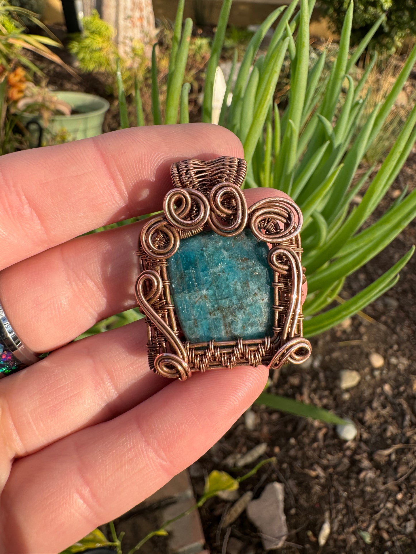 Square apatite wrapped in copper