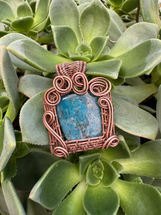 Square apatite wrapped in copper