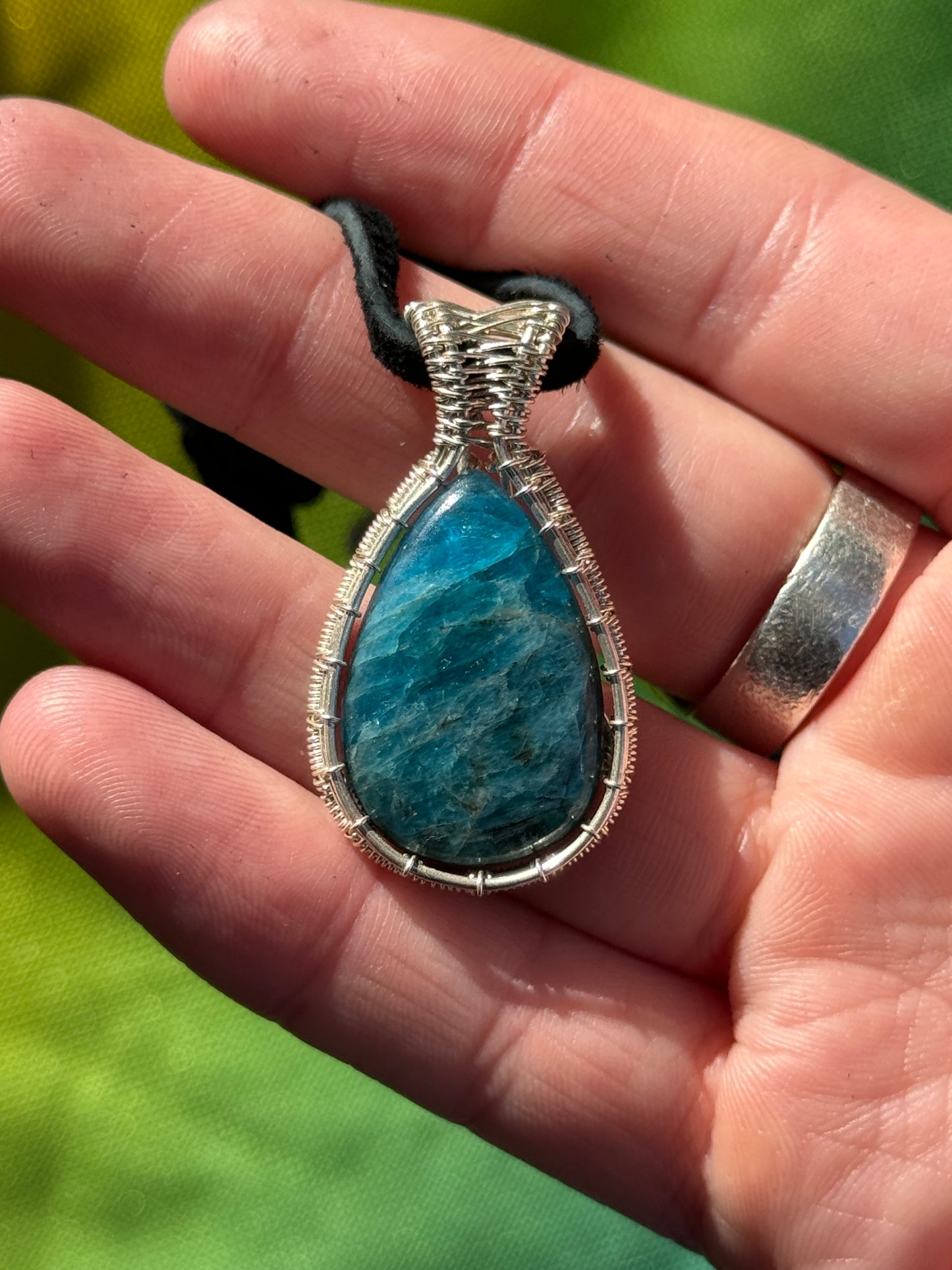 Apatite wrapped in sterling silver